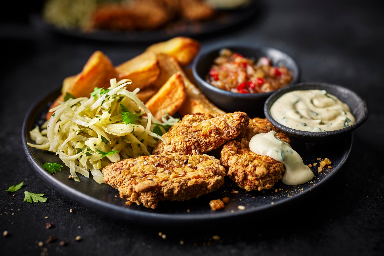 Sesame parmesan chicken goujons with chips and chilli jam