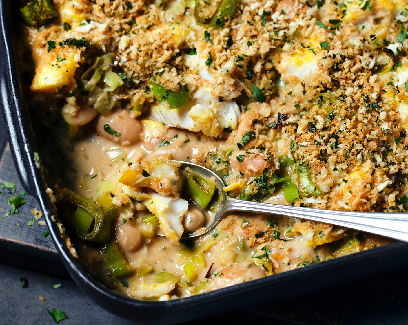 step 5 Top the butter bean mixture with the buttery breadcrumbs, then transfer to the oven and bake for 25 minutes, until the top is golden brown and bubbling and the haddock is cooked through.