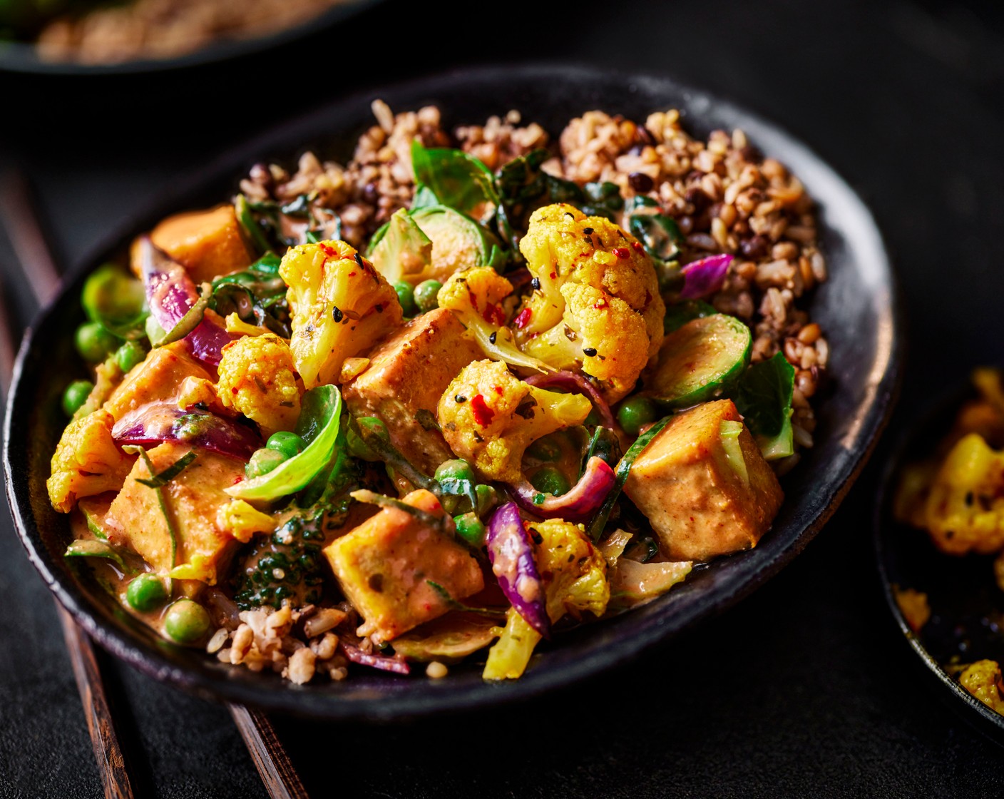 step 6 Stir the butter from the sprouts pack into the tofu curry. Serve in bowls with the 7-grain medley and some pickled cauliflower (1 tub).