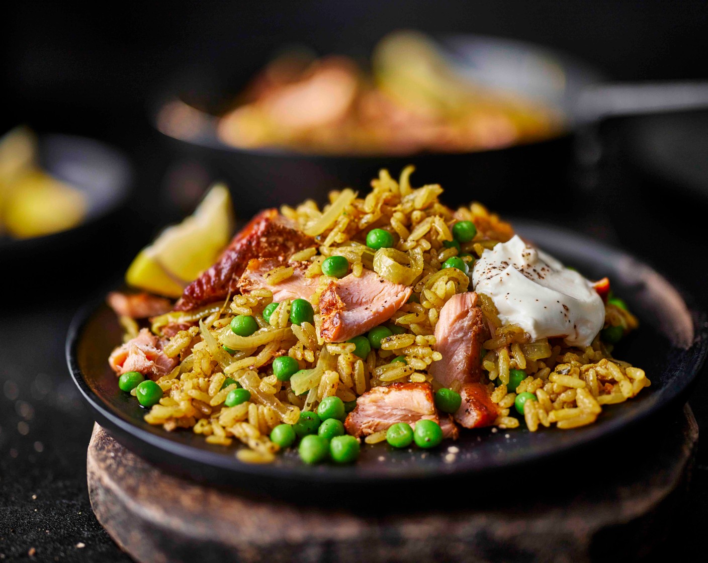 step 5 Season the yogurt (100 g) with salt and pepper. Spoon the biryani into bowls and serve with a dollop of the seasoned yogurt and the lemon wedges (1).