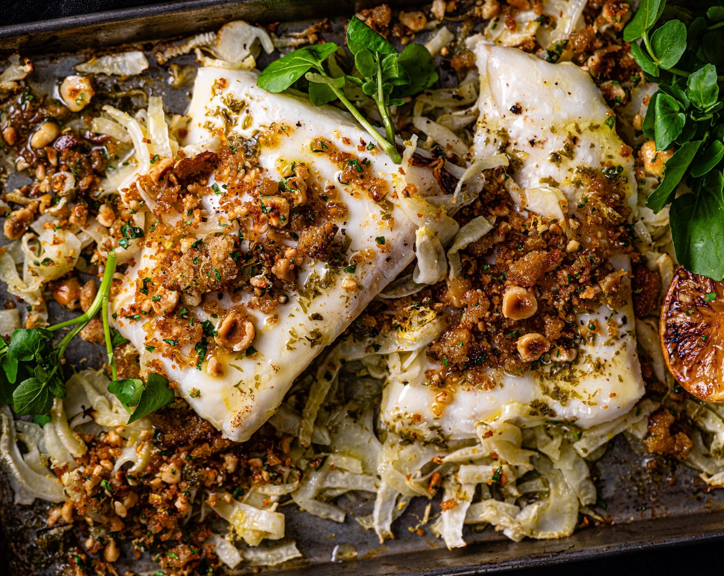 step 6 Serve the fish and fennel with the nutty breadcrumbs on top, squeezing the lemons from the tray over the fish, a handful of watercress (2 handfuls), and the remaining lemon (1), cut into wedges.