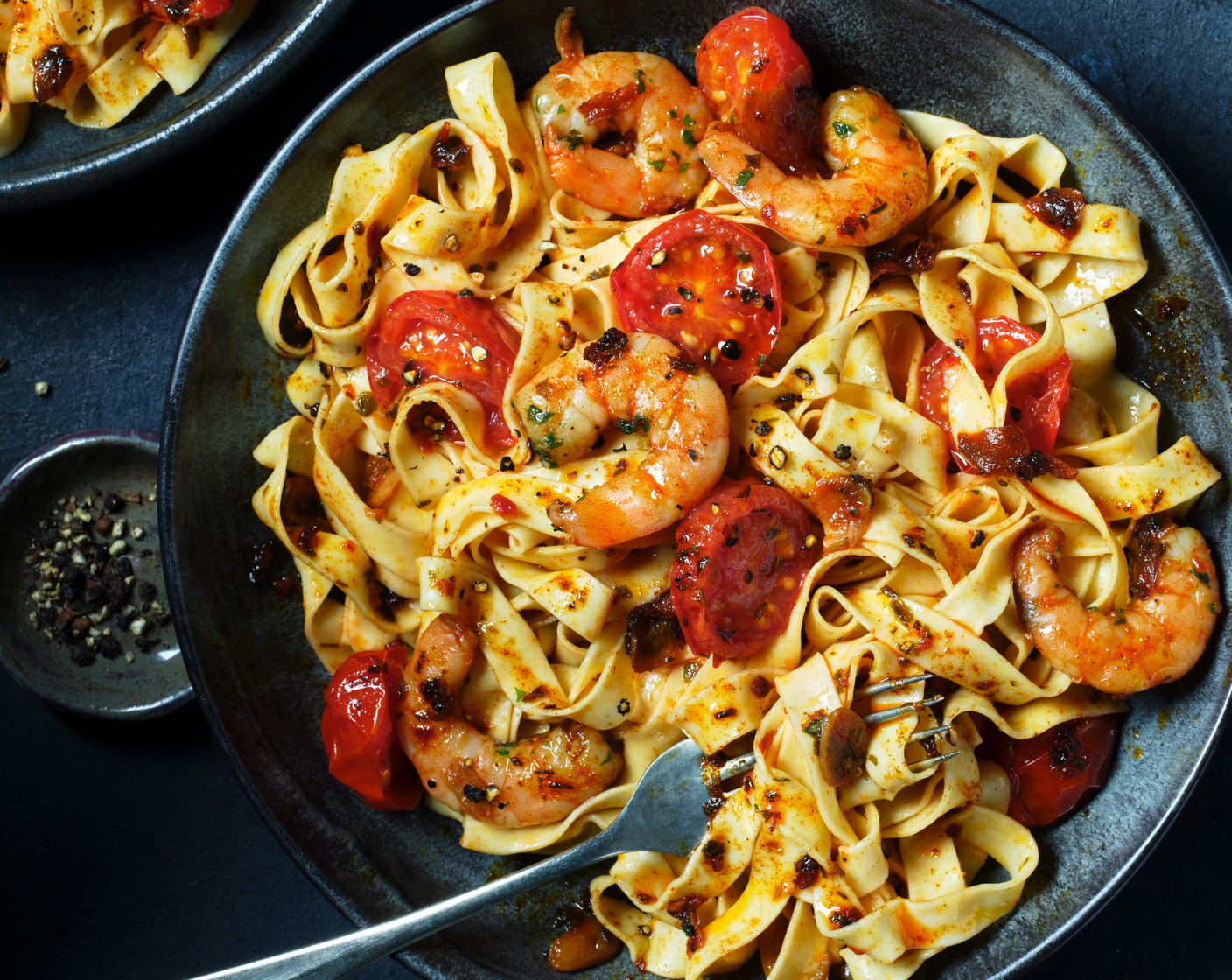 step 3 Drain the pasta, reserving a splash of the cooking water, and toss with the prawns, adding a splash of cooking water as needed to create a glossy sauce. Serve in bowls with black pepper on top.