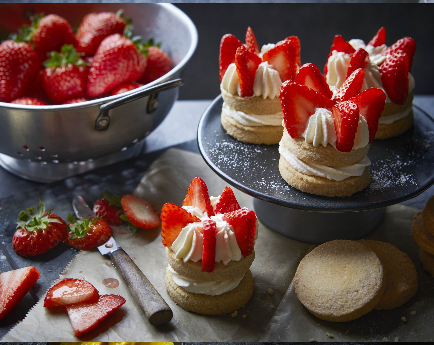 step 4 Decorate the tops of the shortbread sandwiches with the strawberries (400 g) to resemble a crown.