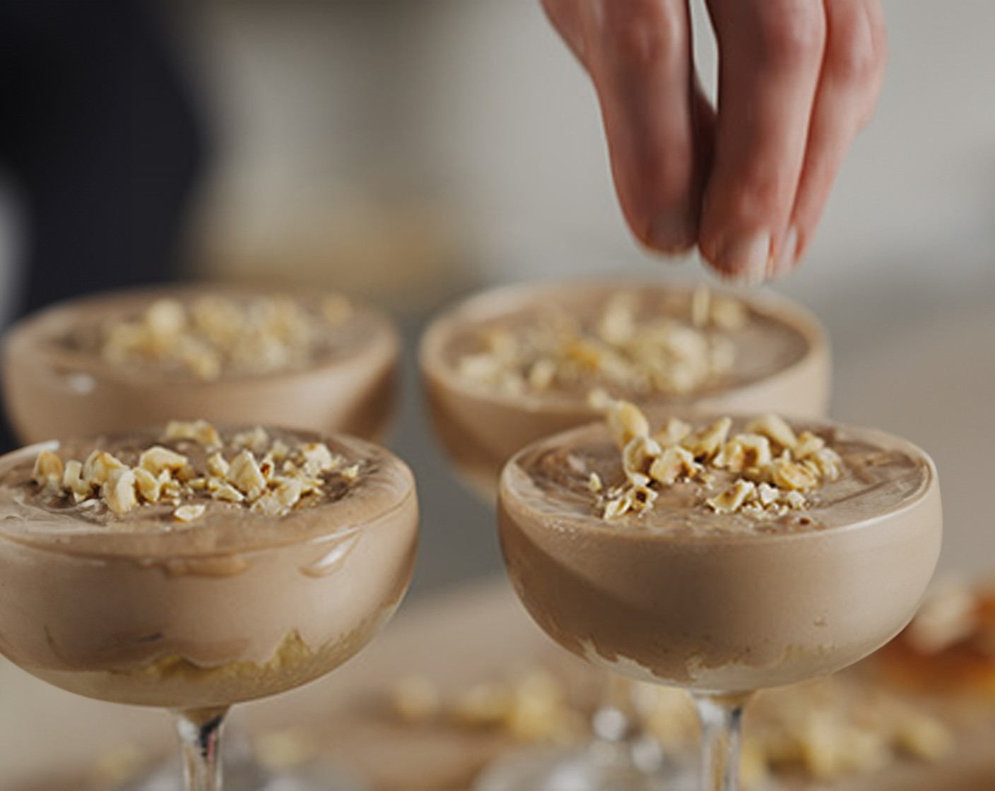 step 3 Spread the mixture over the biscuit base in each serving bowl and top with the chocolate shavings (50 g). Refrigerate for at least 4-5 hours before serving.