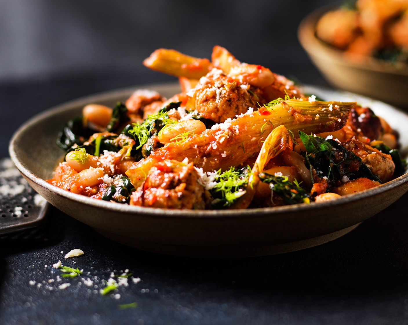 step 5 Divide between bowls, sprinkle over the grated parmesan (50 g), then serve.