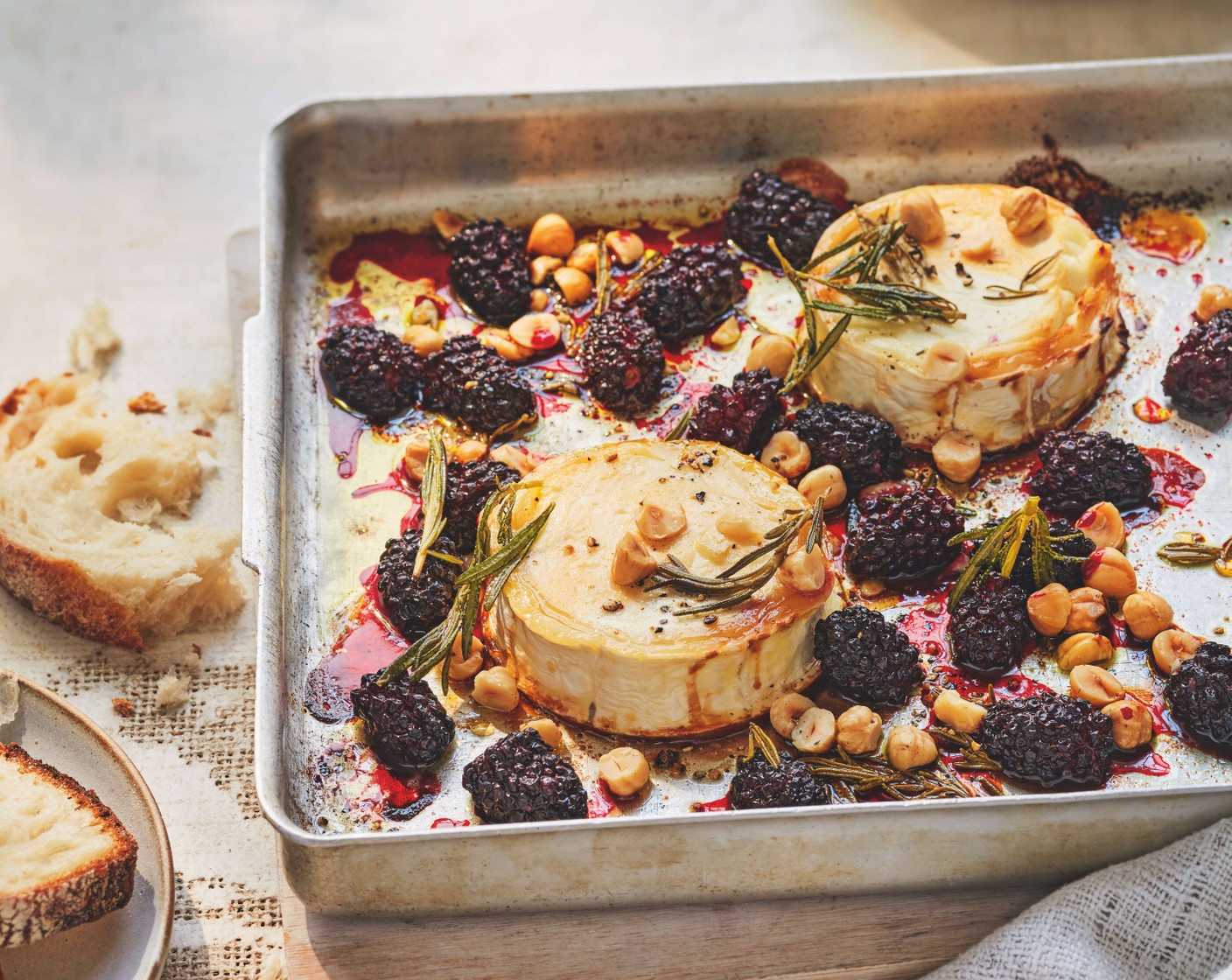 Baked goat's cheese with honey, blackberries and hazelnuts