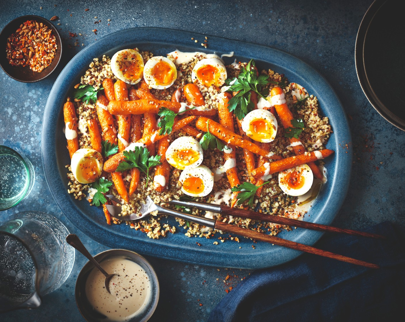 step 4 Toss the carrots and quinoa together and spread out onto a serving plate. Top with the eggs and the dressing, then scatter over the dukkah (2 tbsp) and parsley (1 handful).