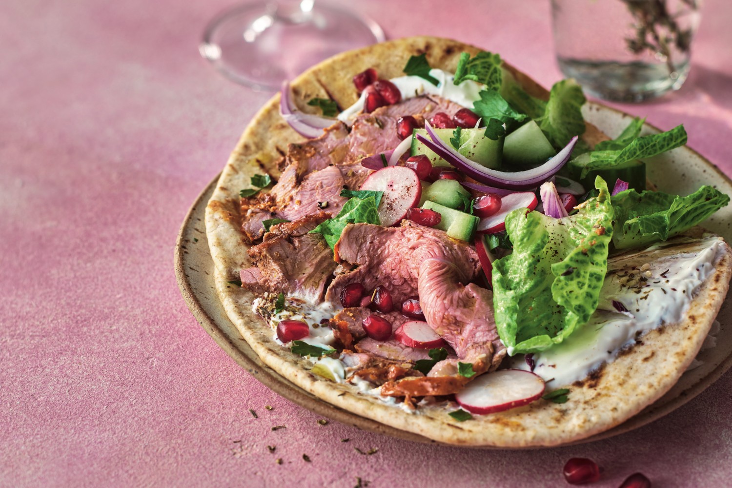 Harissa and honey-roasted leg of lamb with pomegranate salad