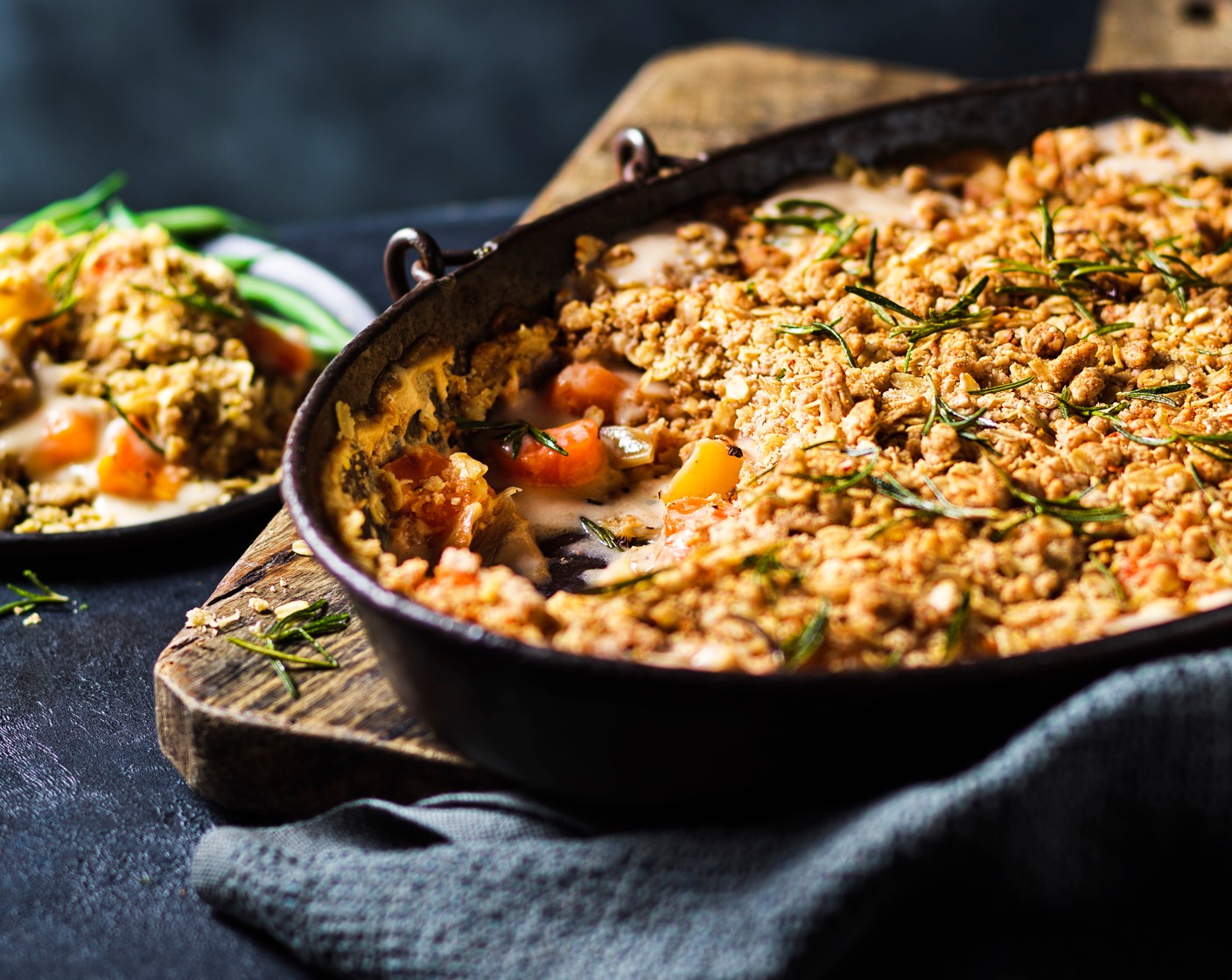 step 5 Sprinkle the crumble topping over the creamy root vegetables. Drizzle with olive oil and bake for 20-25 minutes, or until golden on top. Sprinkle over the crispy rosemary. Serve with lemony dressed green beans or Tenderstem broccoli, if you like.