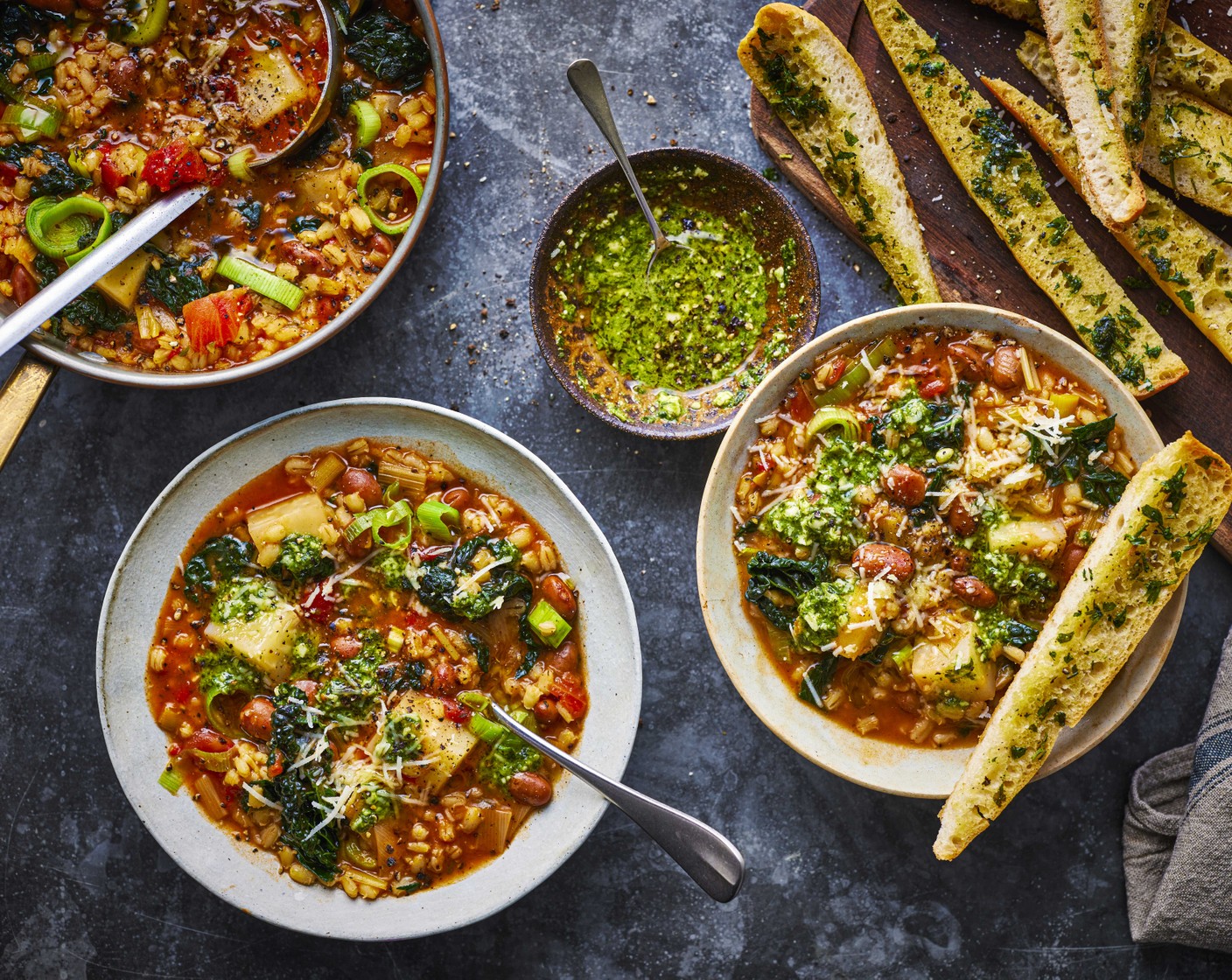 step 6 Ladle the soup into bowls and add a tablespoon of M&S fresh green pesto (1/2 tub) to each bowl. Sprinkle with a little extra parmesan then serve with the cooked ciabatta sticks.