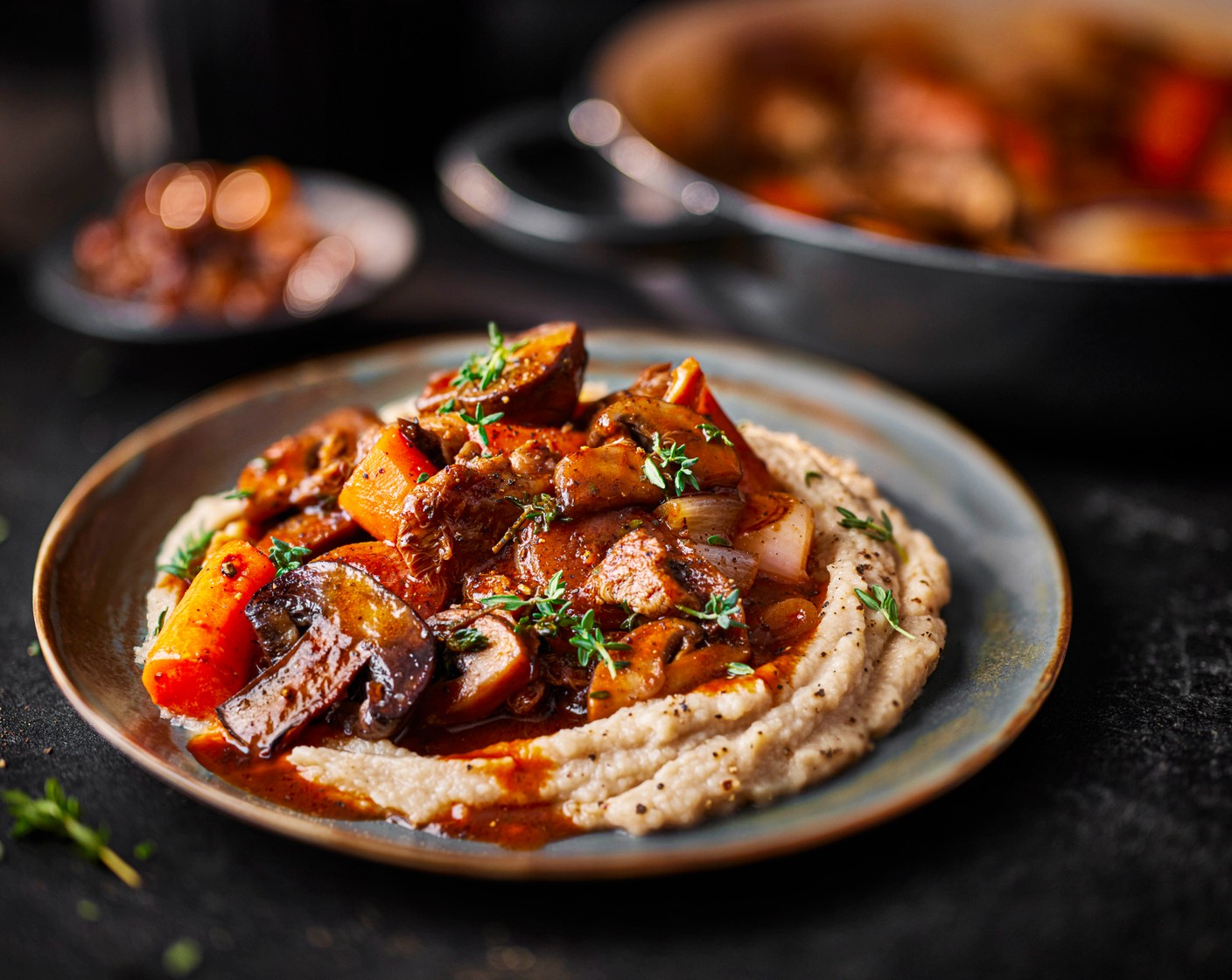 step 4 Serve the celeriac mash in shallow bowls, topped with the mushroom bourguignon, and top with a few extra thyme leaves.