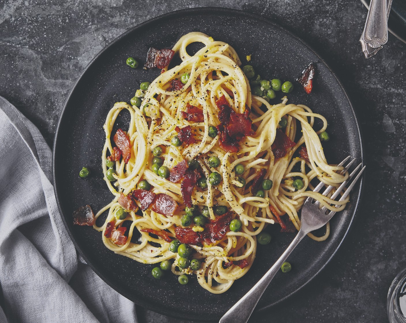 step 7 Pour in the egg and cheese mixture, toss through the pasta and stir for 2 minutes to allow the heat from the pasta to cook the eggs. Serve with a pinch of black pepper and the cooked garlic baguette.