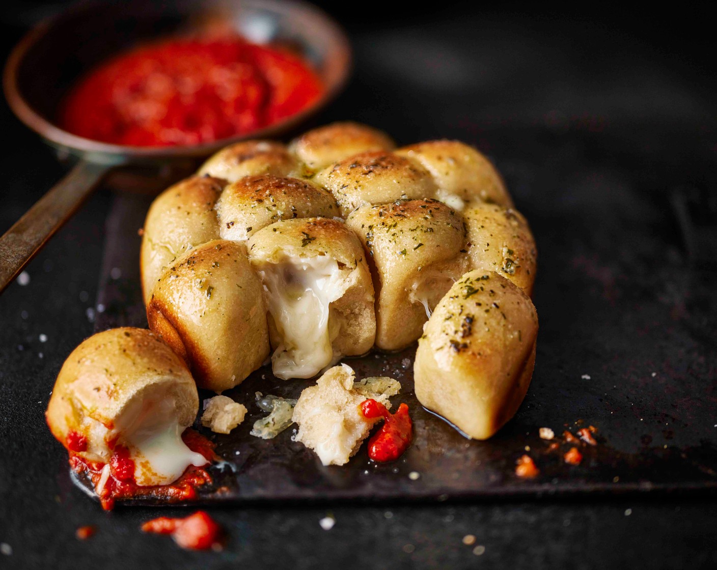 step 8 Remove the doughballs from the tin and serve with the tomato sauce for dipping.