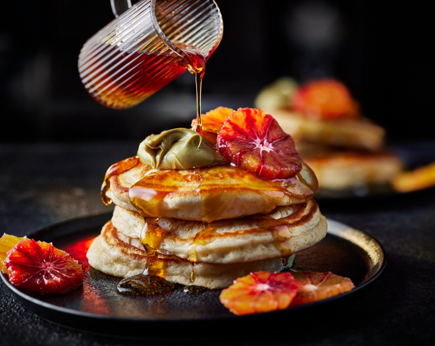 step 4 Serve the pancakes with the blood oranges, a dollop of pistachio crème (2 tbsp) and a drizzle of maple syrup (2 tbsp), or pile into one large stack for everyone to help themselves.
