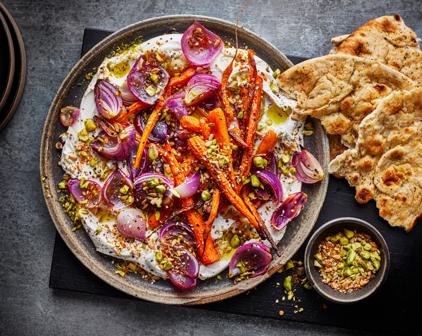 step 5 Spread the tahini sauce onto a platter. Top with the warm carrots and sprinkle with the pistachio dukkah.