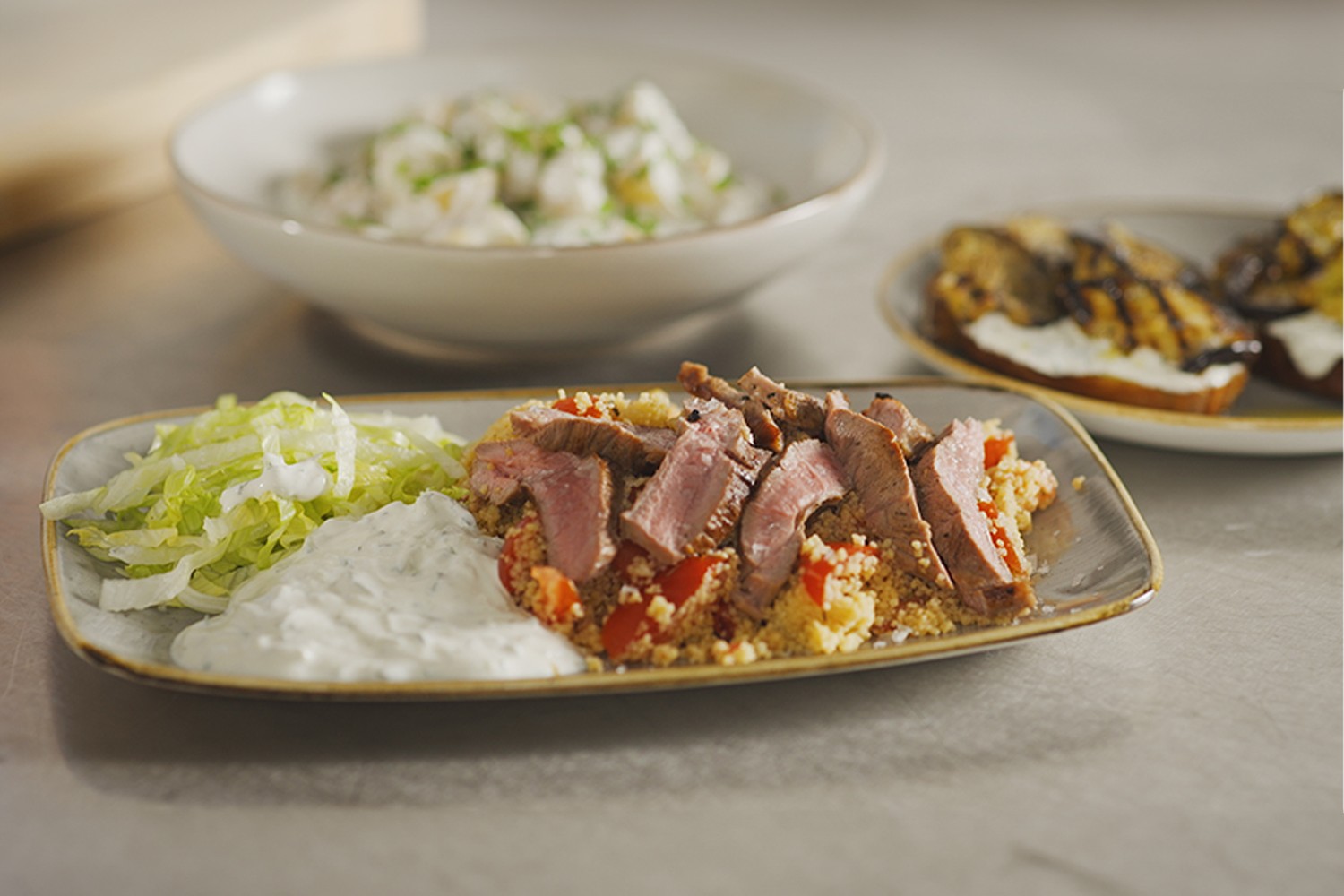 Greek-style lamb on couscous