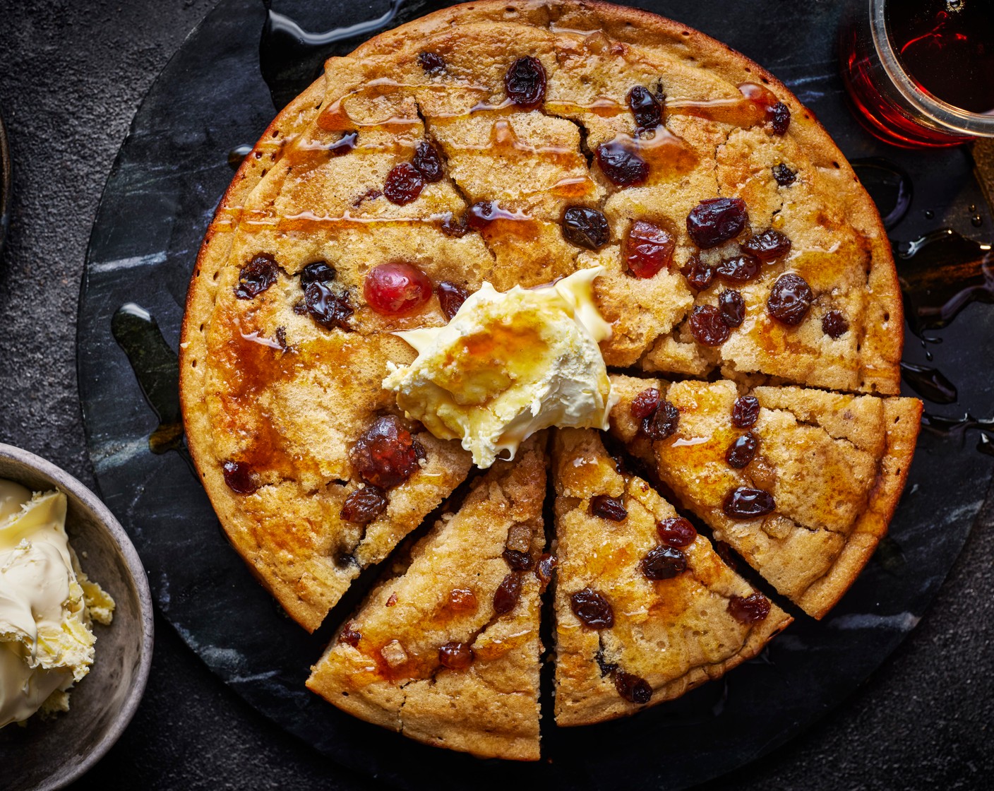 step 4 Place the pan in the oven and cook for a further 10 minutes. Flip onto a plate. Cut into six wedges, dot a spoonful of clotted cream (2 tbsp) over each and drizzle with maple syrup (as needed) to serve.