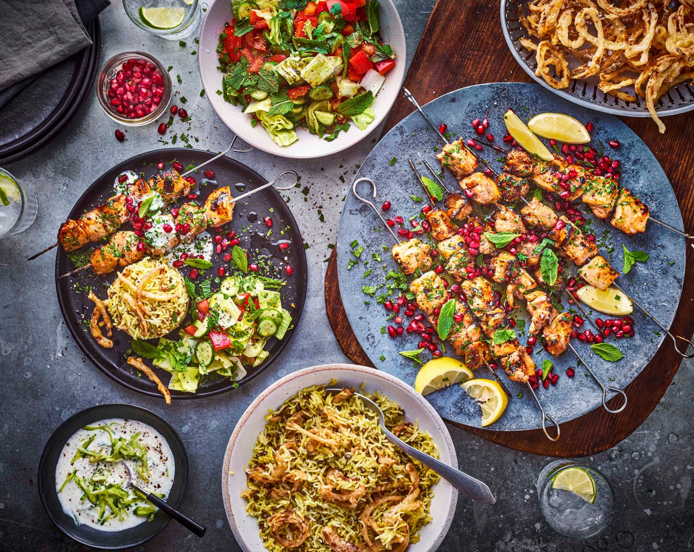 step 10 To serve, arrange the chicken on a serving platter and garnish with the coriander (15 g), mint (15 g) and pomegranate seeds (75 g). Serve with the Mujadara, spooned neatly onto a plate and topped with the remaining onions and a scattering of coriander (15 g), along with the dressed Arabic salad and the cucumber mint yogurt sauce.