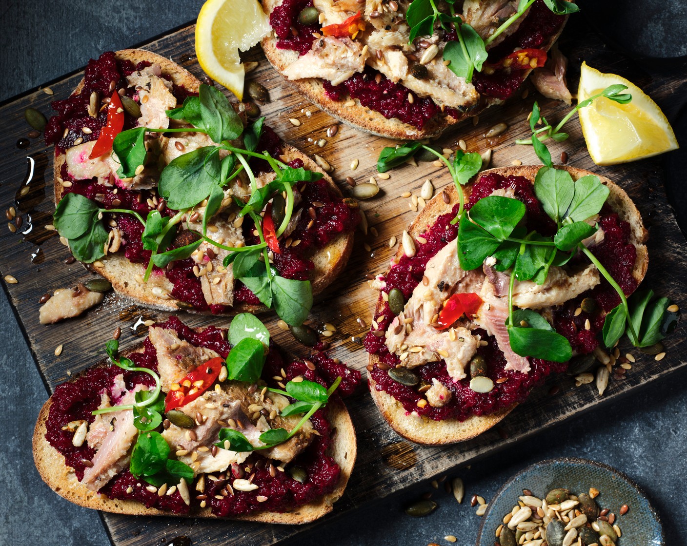 step 2 Toast the bread (4 slices) and spread with the beetroot dip. Top with the sardines (1 tin) with a little of their oil, the pea shoots (1 handful) and a sprinkle of seeds (2 tsp). Serve with a lemon wedge.