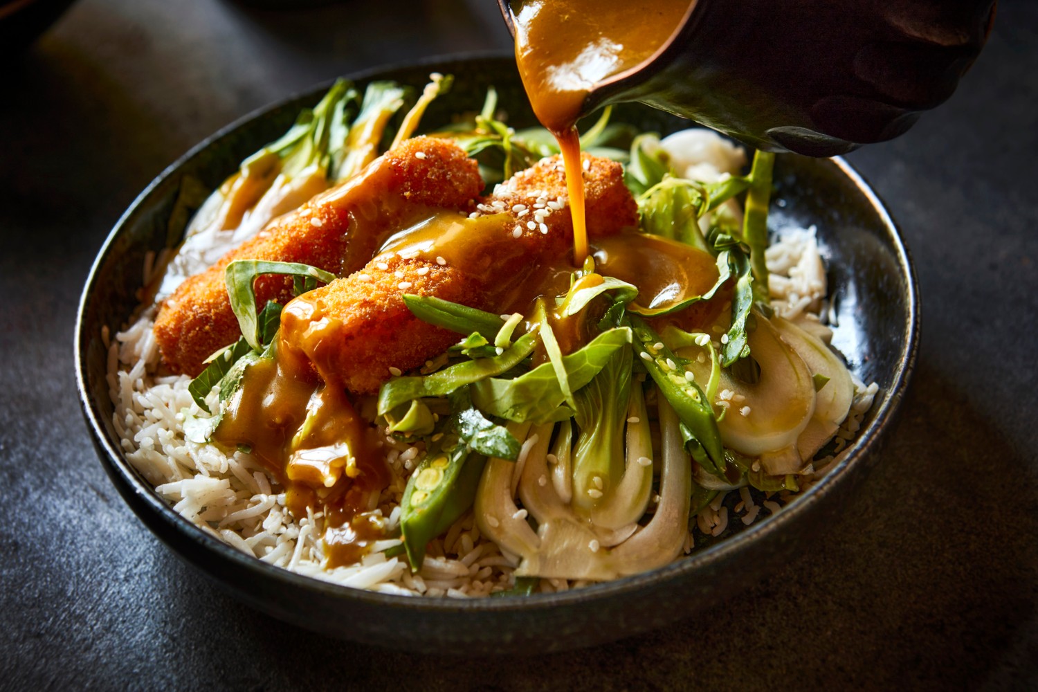 Fish finger katsu curry and sugar snap pea slaw