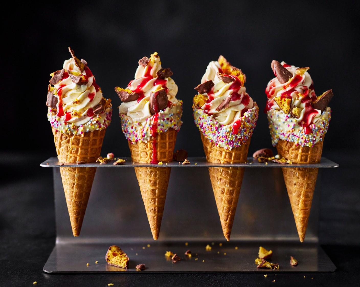 step 5 Pipe the cheesecake filling into the waffle cones. Serve scattered with the honeycomb (50 g) and a drizzle of the remaining raspberry coulis.