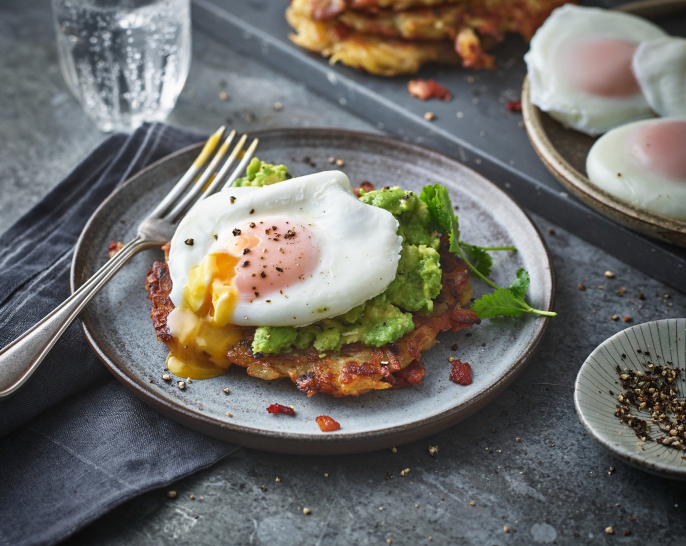 step 7 Serve up the crispy cakes with the mashed avocado (2) and poached eggs on top.