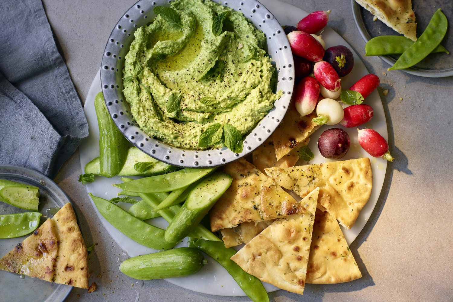 Avocado, pea and feta dip with garlic flatbreads