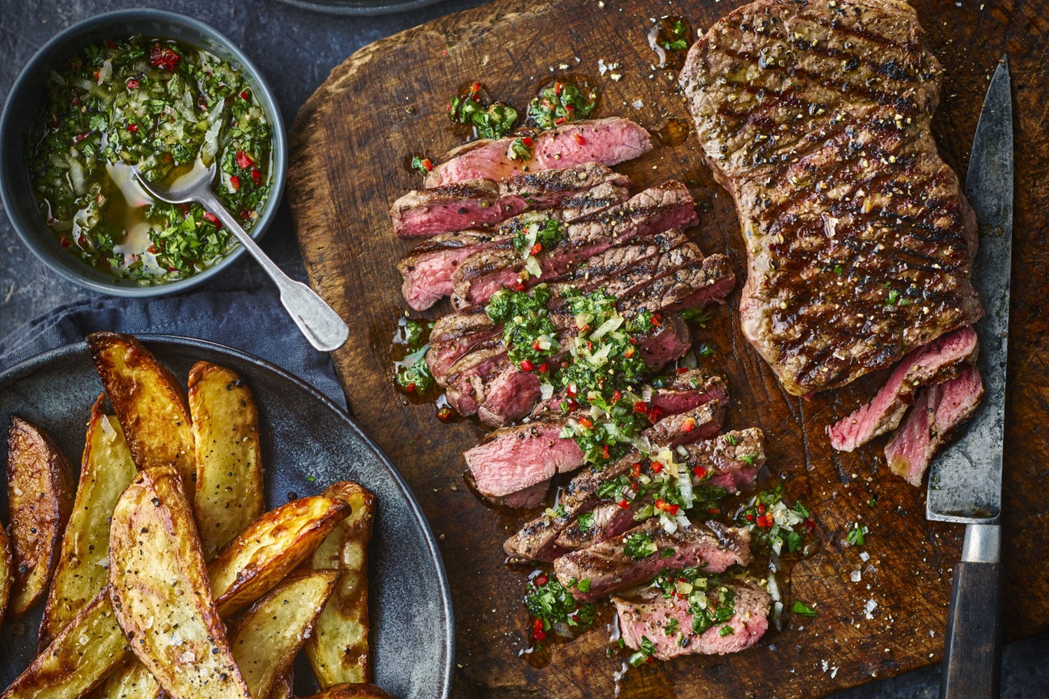 Sirloin steak with chimichurri and potato wedges