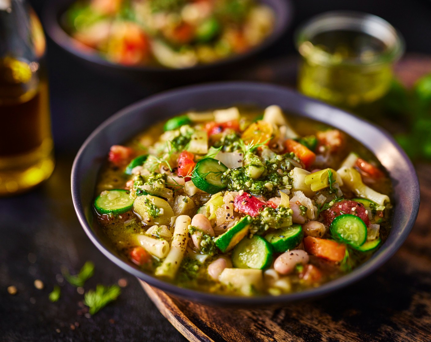 step 4 Stir in half the pesto (1 tub). Spoon the soup into bowls (it’s nice to serve it not piping hot, or room temperature) before topping with the remaining pesto and a drizzle of lemon oil (2 tbsp).