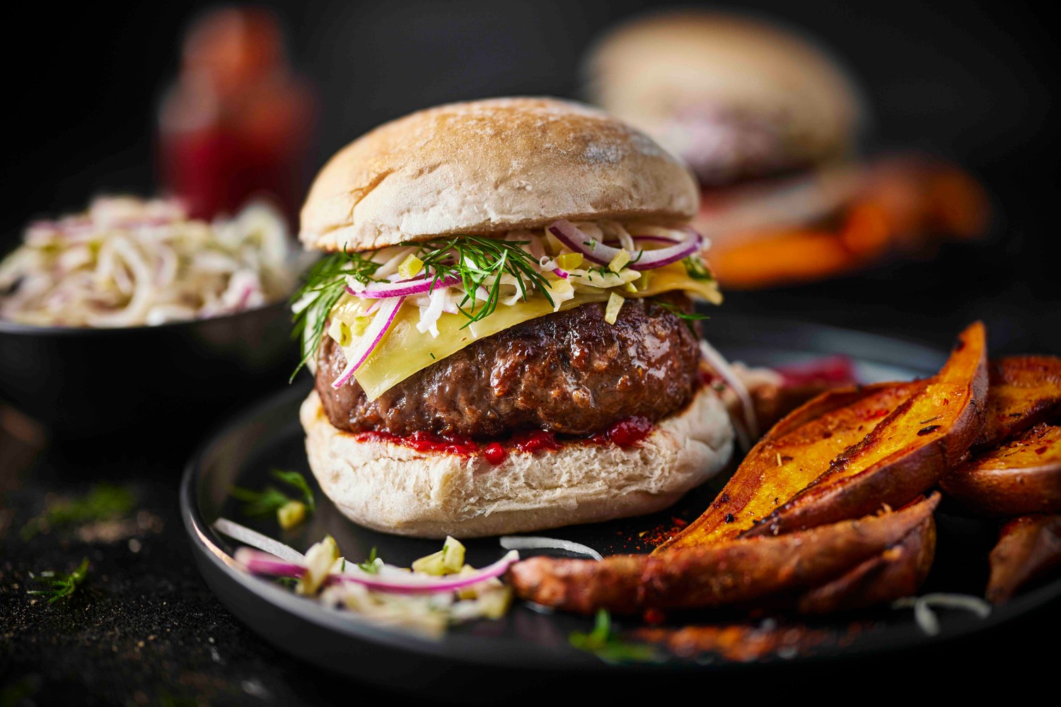 Beef burger recipe with sweet potato wedges and slaw