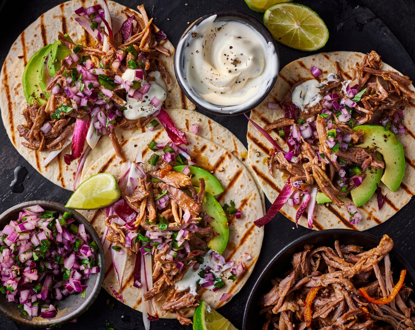 step 5 Load up the tacos (1 pack) with the lamb followed by the salsa and chicory (1). Serve with a squeeze of lime.