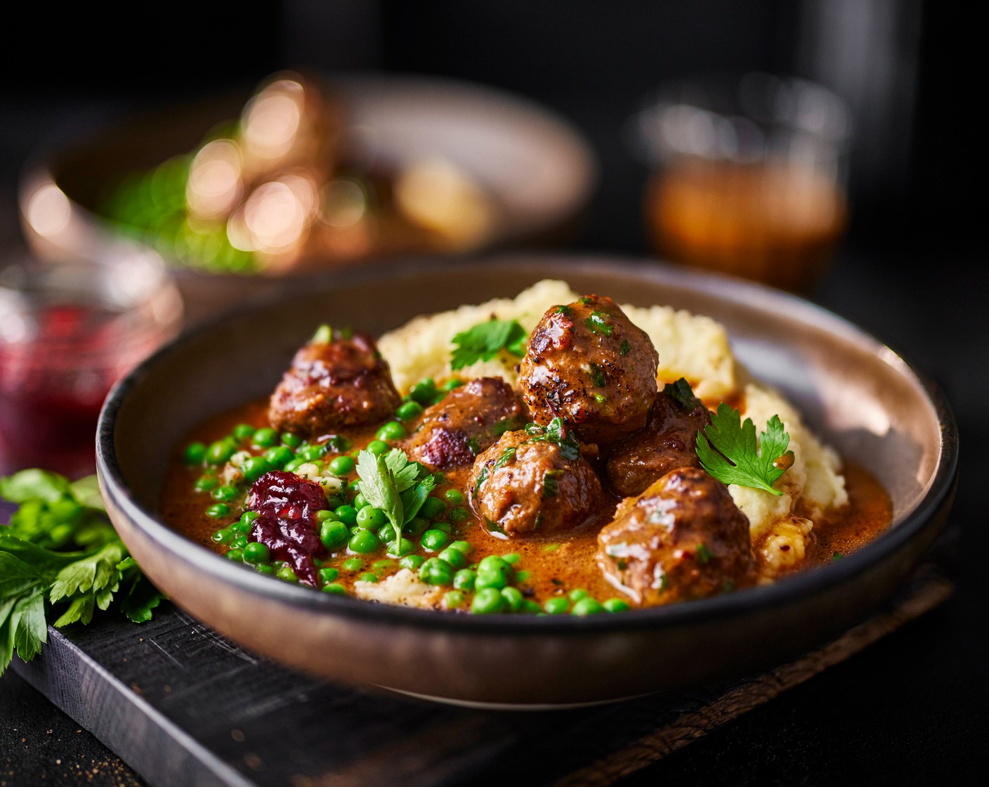 step 7 Serve the mash in bowls, top with the creamy cranberry meatballs, and peas on the side.