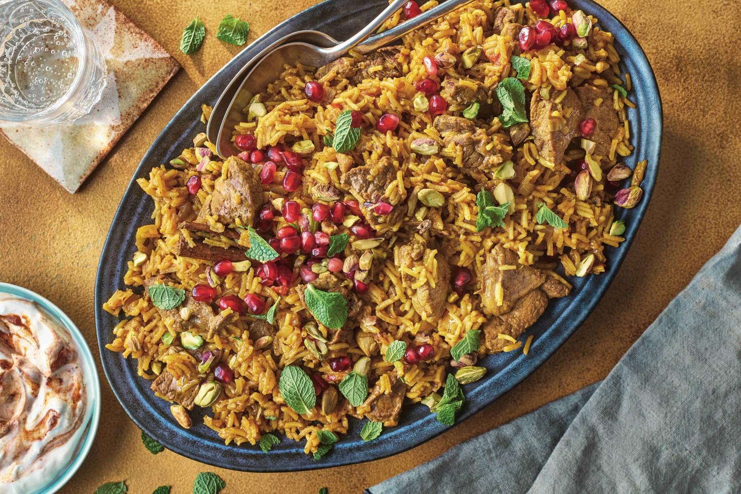 Jewelled lamb pilaf with spiced yogurt