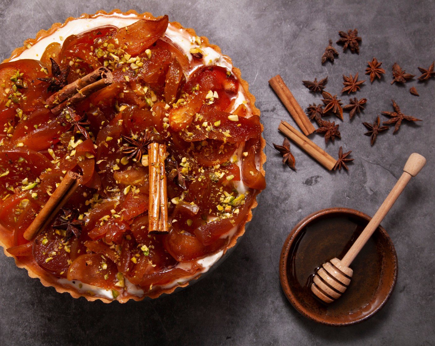 step 6 To serve, place the pastry case (1) on a plate or cake stand. Spoon in the cream, arrange the apple slices on top and scatter with lemon zest (as needed) and pistachio nuts (1 handful) if using. Serve immediately.