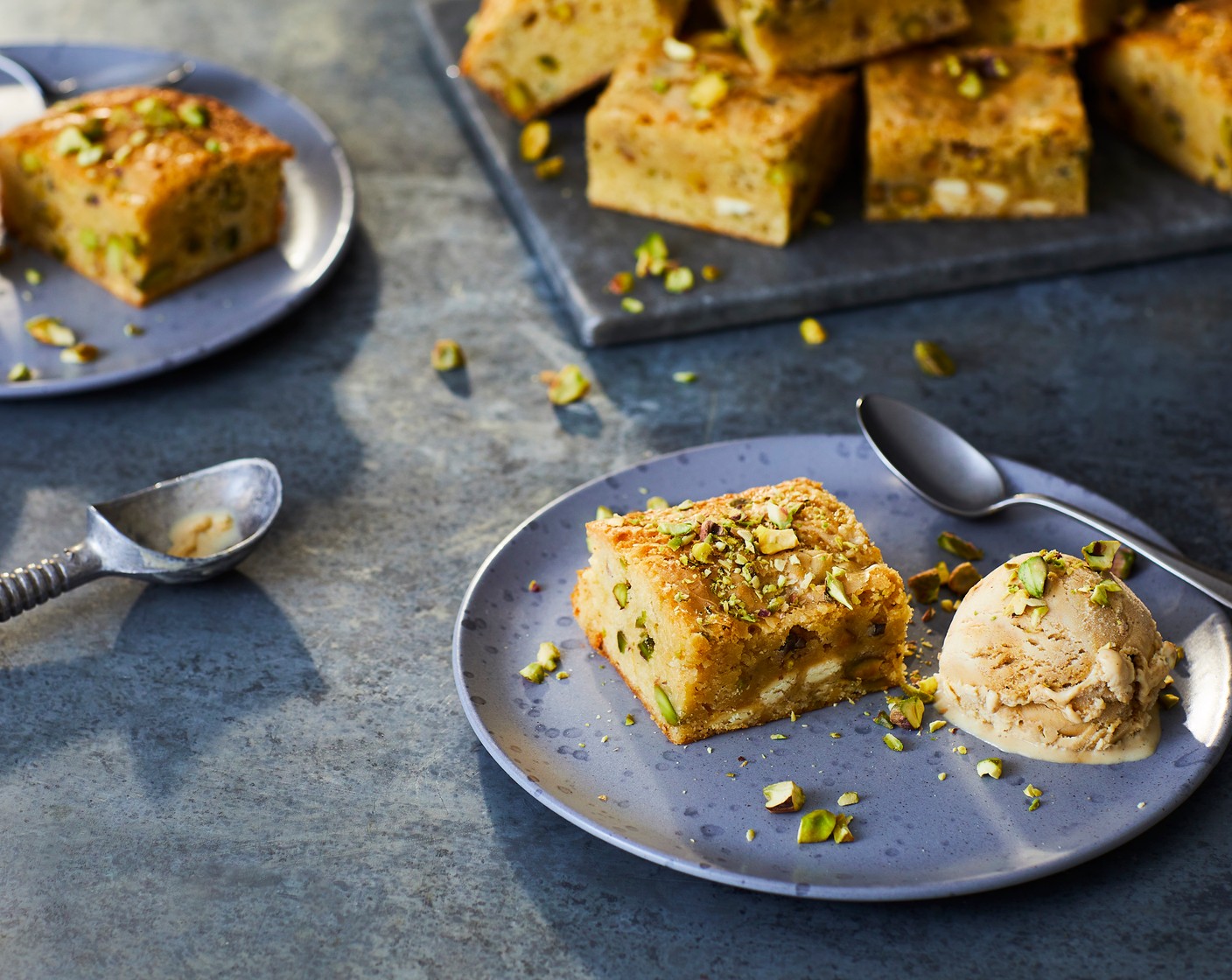 step 4 Serve the blondies with a scoop of pistachio ice cream (as needed) and a scattering of remaining pistachios.
