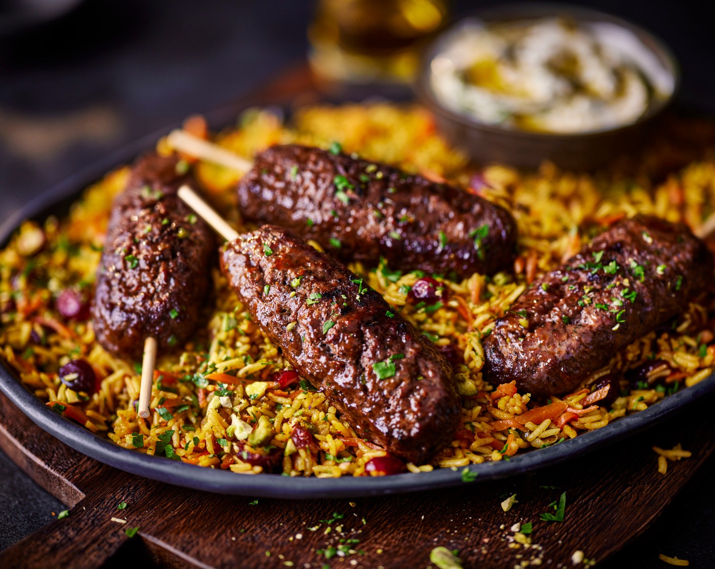 step 6 Stir the parsley (15 g) through the cooked rice, and top with the chopped pistachios (50 g). Serve alongside the koftas and plenty of labneh (to taste).