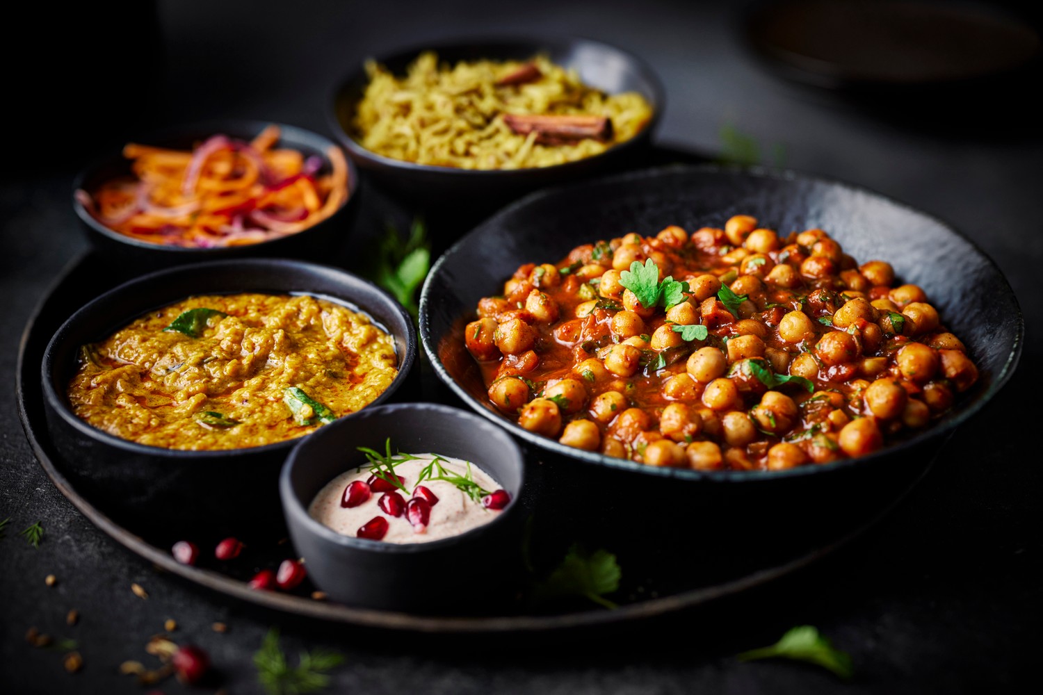 Vegetable thali with red lentil dal and chickpea curry