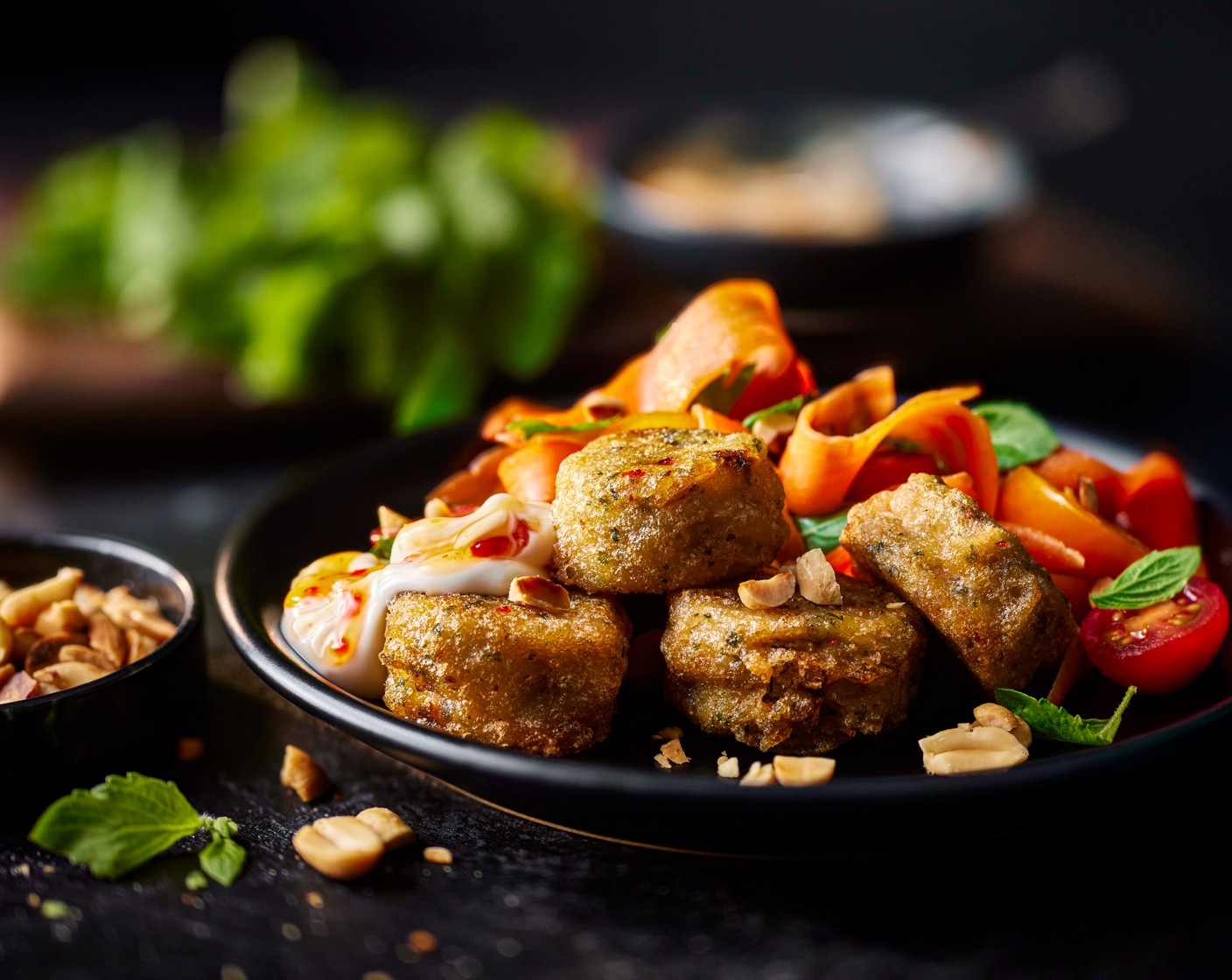 step 5 Scatter the peanuts over the carrot salad and serve alongside the fishcakes with the sweet chilli mayo.