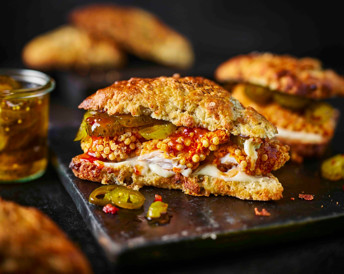 step 8 Allow the scones to cool slightly before slicing in half and filling with the chicken, hot honey sauce (that comes with the chicken), garlic mayo (as needed) and pickles (as needed).