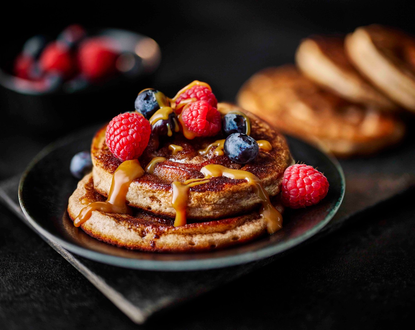 step 7 Drizzle the warm sauce over the pancakes and serve with a handful of berries (1 pack).