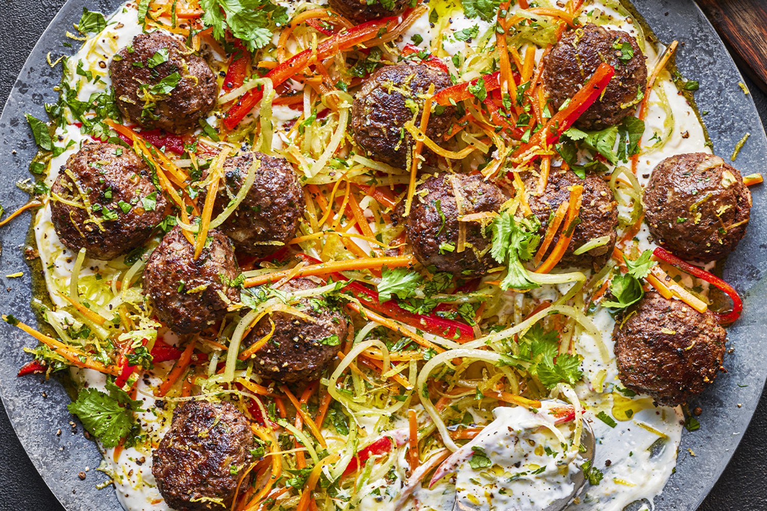 Spiced beef meatballs with creamy labneh and crunchy slaw