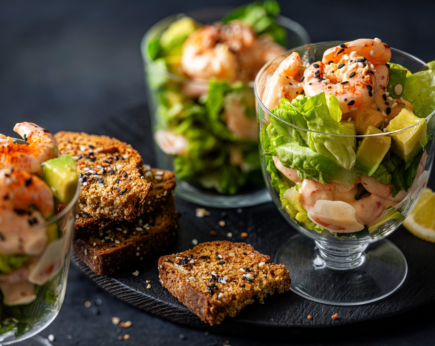 step 6 Sprinkle the prawns with the remaining everything seasoning (1 tbsp) and add a pinch of cayenne pepper (1/2 tsp). Serve with the toasted bread and the remaining lemon (1), cut into wedges.