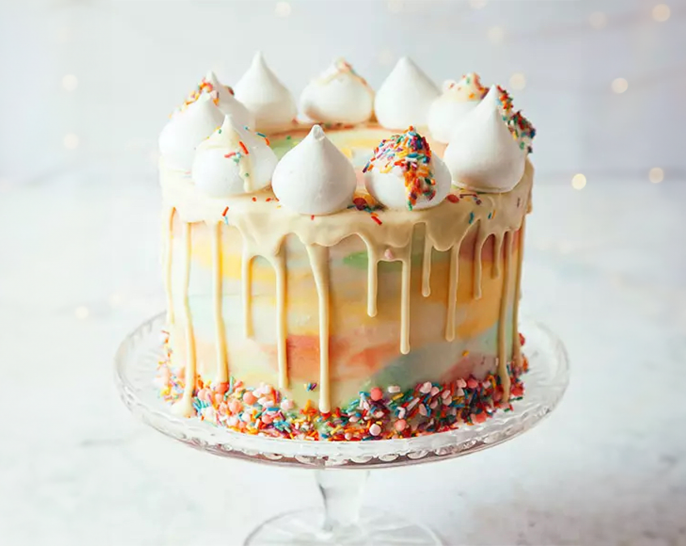 step 21 Drizzle the extra chocolate over the meringues (1 tub) and add Percy sprinkles. Arrange the meringues on top of the cake and serve.