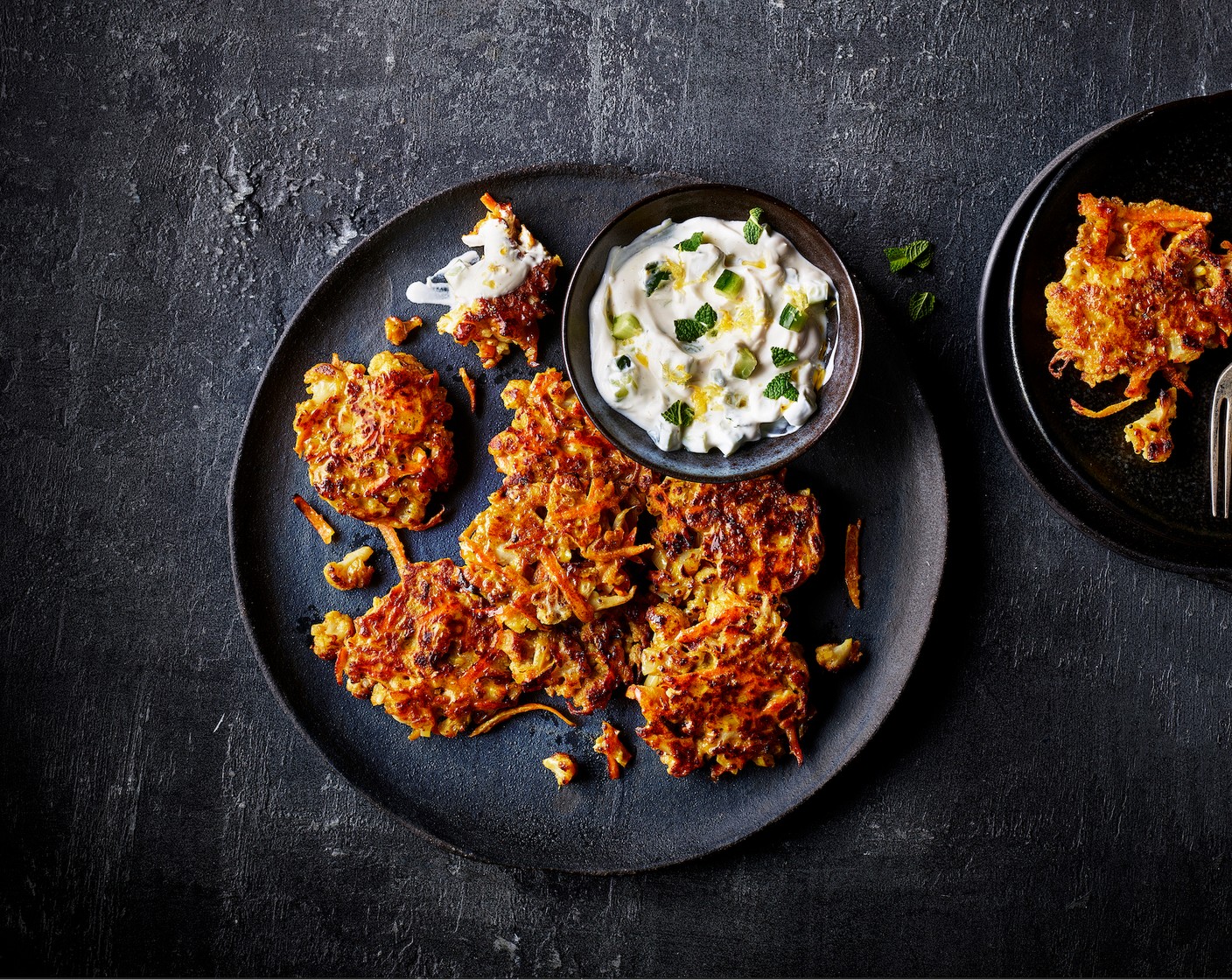 Roasted cauliflower and cumin fritters with cucumber and yogurt dip