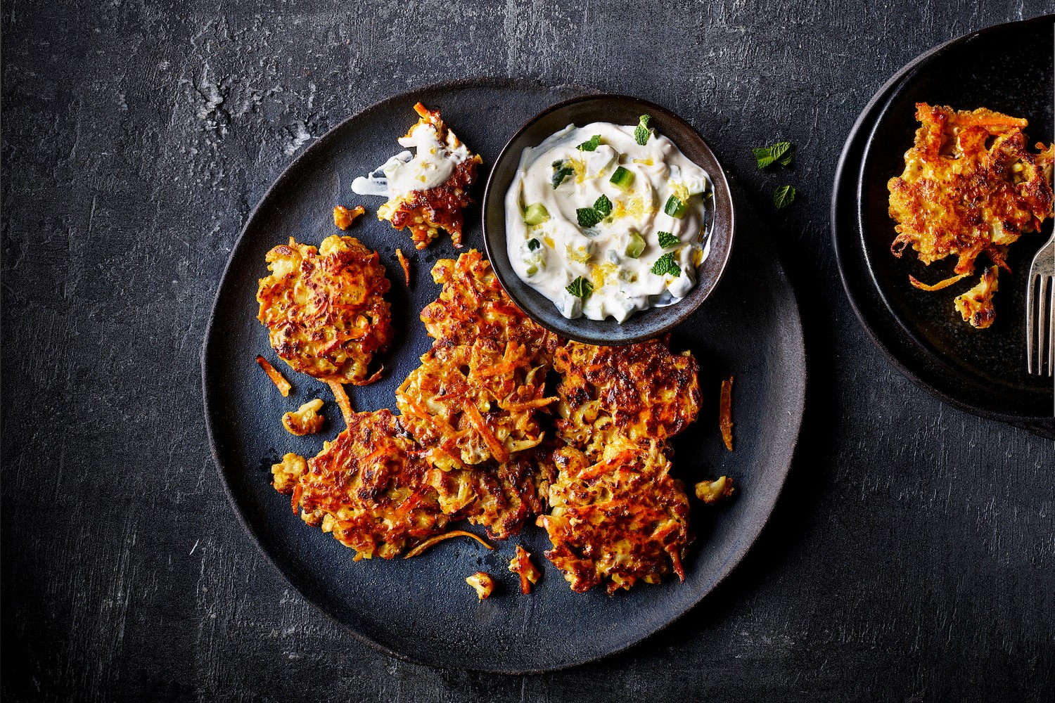Roasted cauliflower and cumin fritters with cucumber and yogurt dip