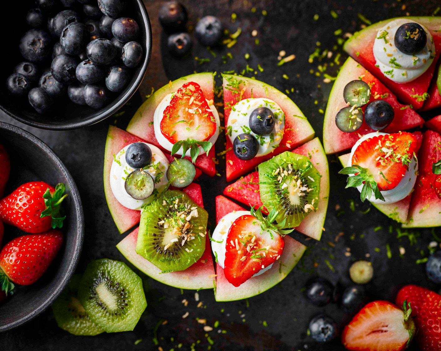 step 4 Spread each of the triangles with a little yogurt (50 g). Decorate each with kiwi chunks (50 g), blueberries (50 g), or strawberry (50 g) and coconut. Grate over a little lime zest (1). Serve straight away.