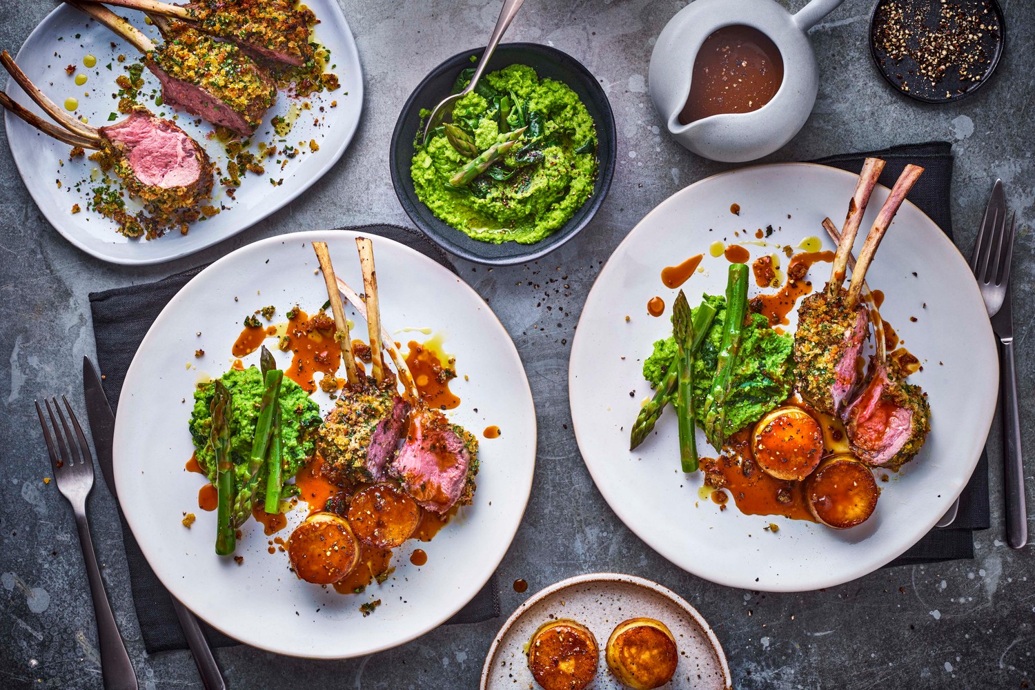 Herb crusted rack of lamb with fondant potato, pea puree, asparagus and thyme jus