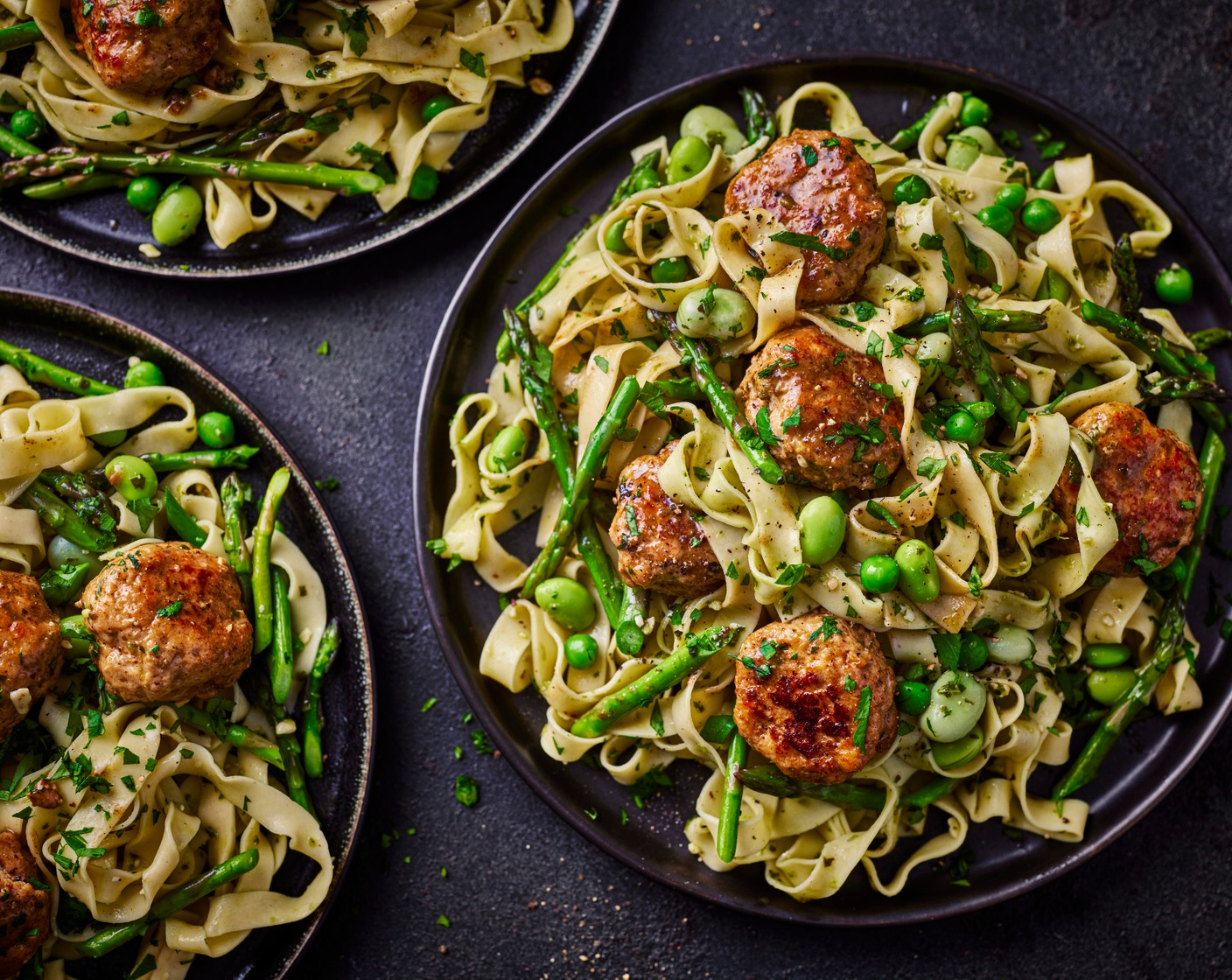 step 6 Reheat the frying pan with 1 tbsp olive oil and add the broad bean mixture and asparagus (180 g). Cook for 2-3 minutes, until just cooked through. Toss with the meatballs and pesto (1 pot). Use tongs to drain the tagliatelle into the pan and toss everything together to coat the pasta in the sauce. Mix through the parsley (15 g) and serve in bowls.