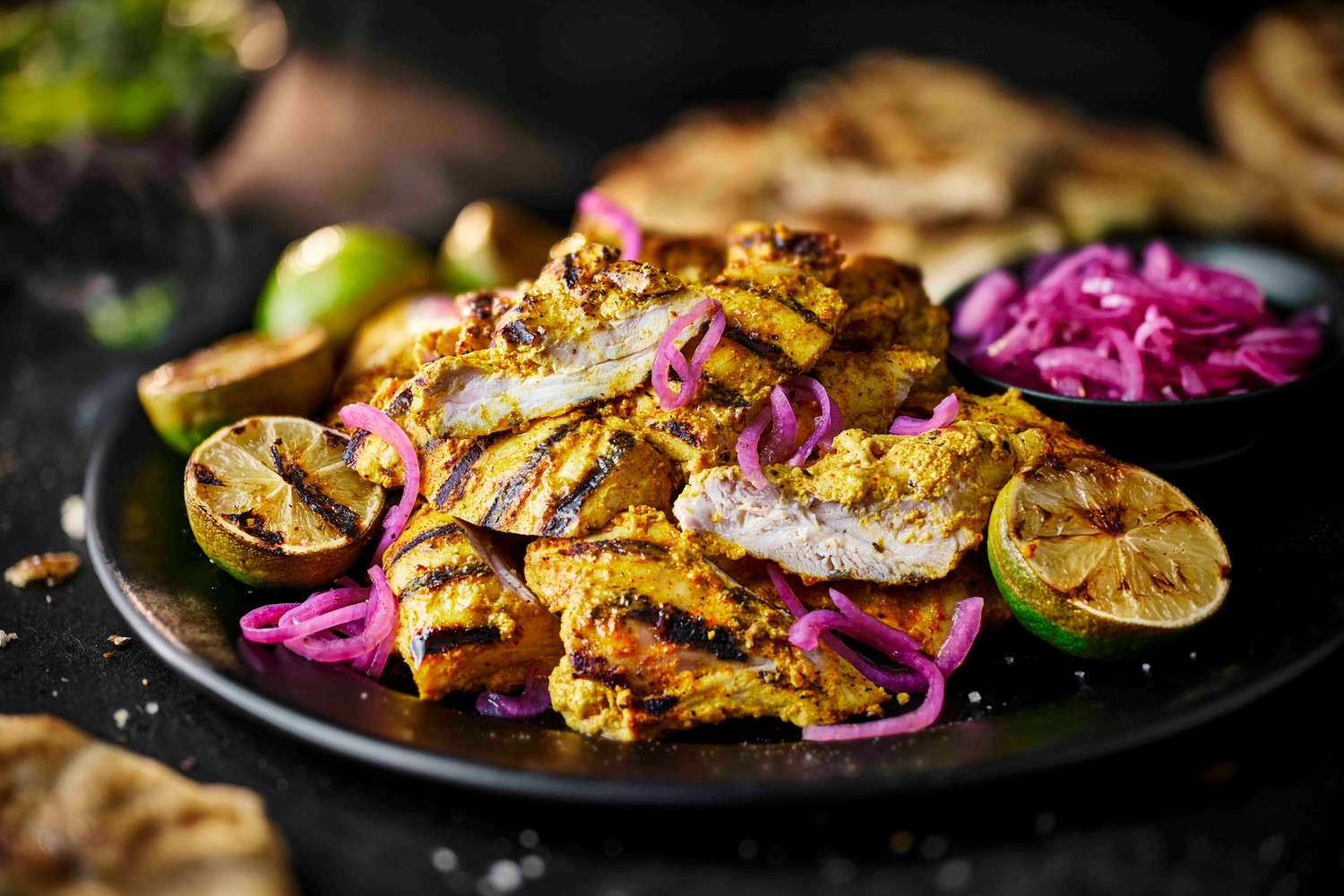 Barbecued burnt lime and turmeric chicken thighs