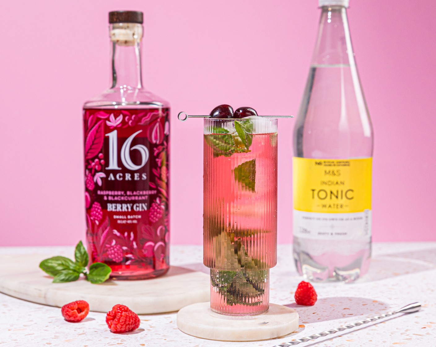 step 1 In the bottom of the glass, lightly muddle together the basil leaf (1 handful) and gin (50 ml). Add ice. Top up with tonic (100 ml) and garnish with the cherries (2) on a cocktail stick.